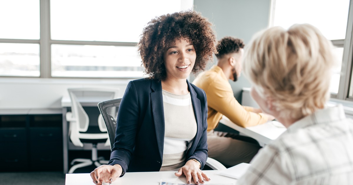 a woman interviewing with another woman through our hiring process