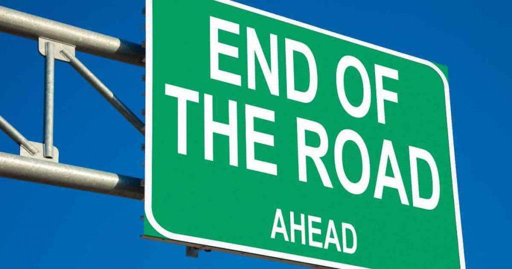 a traffic sign that shows the end of the road