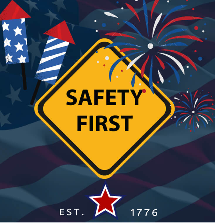 a road sign that reads 'safety first' with fireworks going off behind it