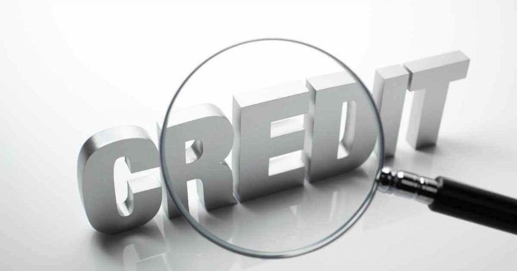 the word credit with a magnifying glass over it to help understand car selection at no credit dealerships near me