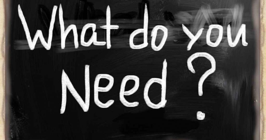 a blackboard with the question what do you need? on it.