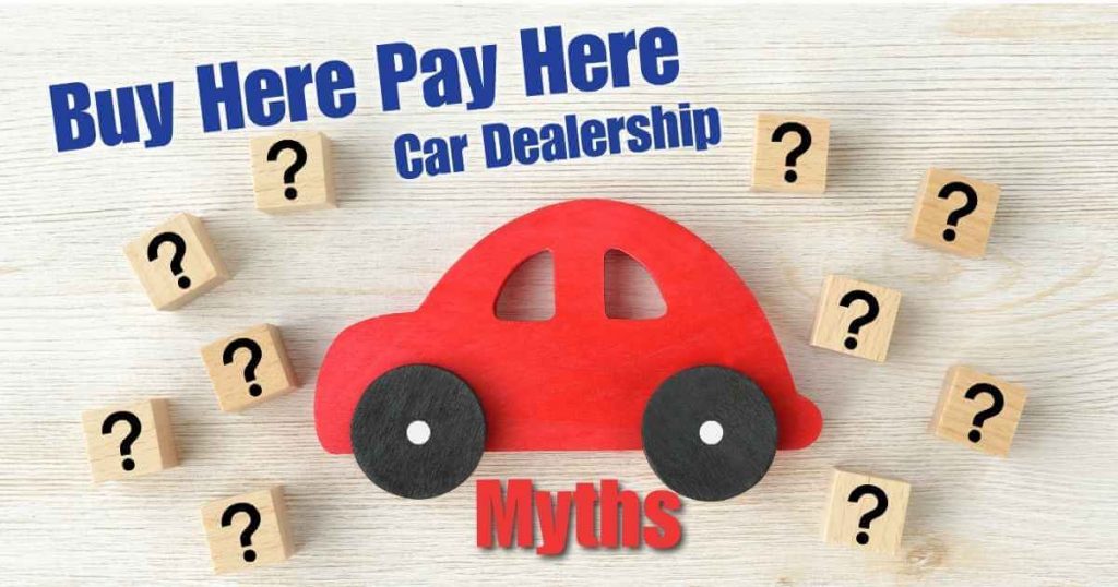 a car with blocks that contain question marks surrounding it and the words 'buy here pay here car dealership myths' by it