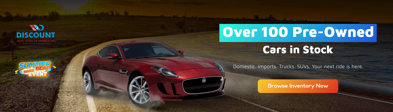 A sleek red Jaguar drives along a winding country road in this banner for Discount Auto Sales of America. It spotlights a large selection of pre-owned domestic and imported cars, trucks, and SUVs, encouraging shoppers to explore the inventory with a “Browse Inventory Now” call-to-action.