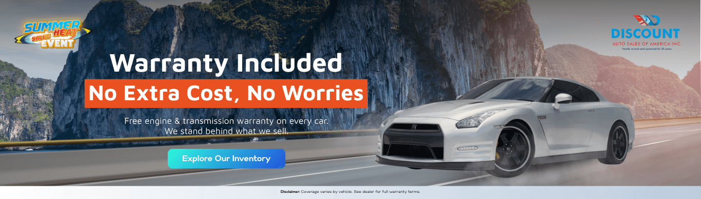 A high-performance Nissan GTR speeds along a coastal road in this banner for Discount Auto Sales of America. It conveys peace of mind with free engine and transmission warranty coverage on every vehicle, supported by a confident “Explore Our Inventory” call-to-action.