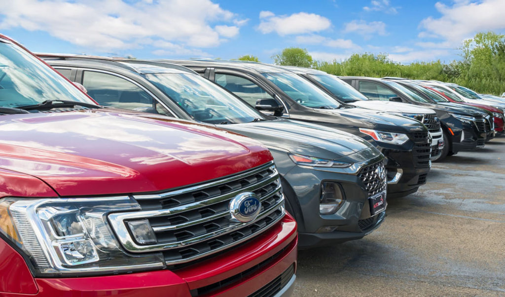 Used cars in Elkhart – Automax dealership lot with SUVs and trucks for sale