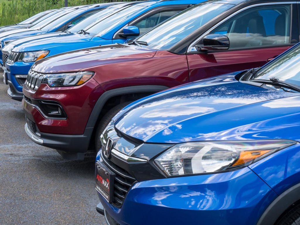 Close-up of used SUVs lined up at Automax Indiana dealership in Mishawaka.