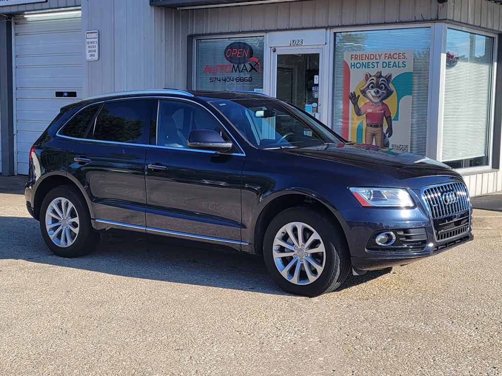 2015 Audi Q5 SUV parked in front of Automax of Indiana dealership in Mishawaka, Indiana.