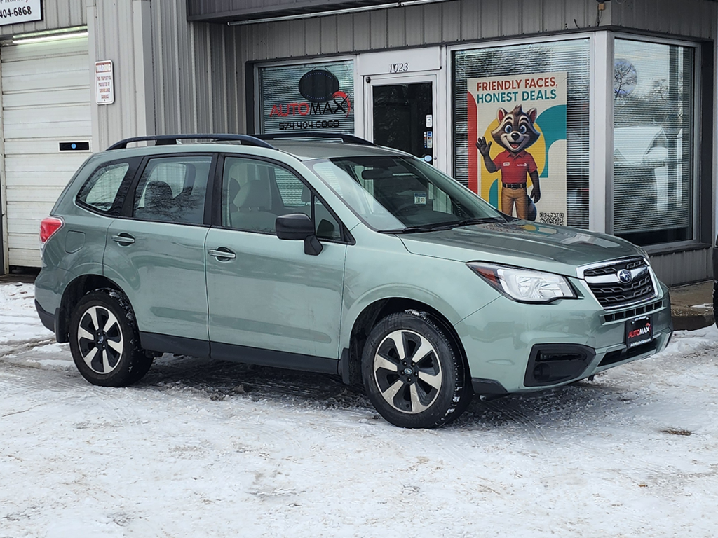2017 Subaru Forester parked in front of the Automax of Indiana building on a snowy dealership lot in Mishawaka, Indiana.