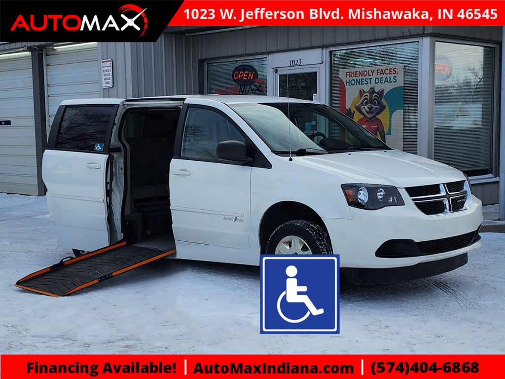 White wheelchair-accessible van with a side-entry ramp parked at an auto dealership in Mishawaka, Indiana