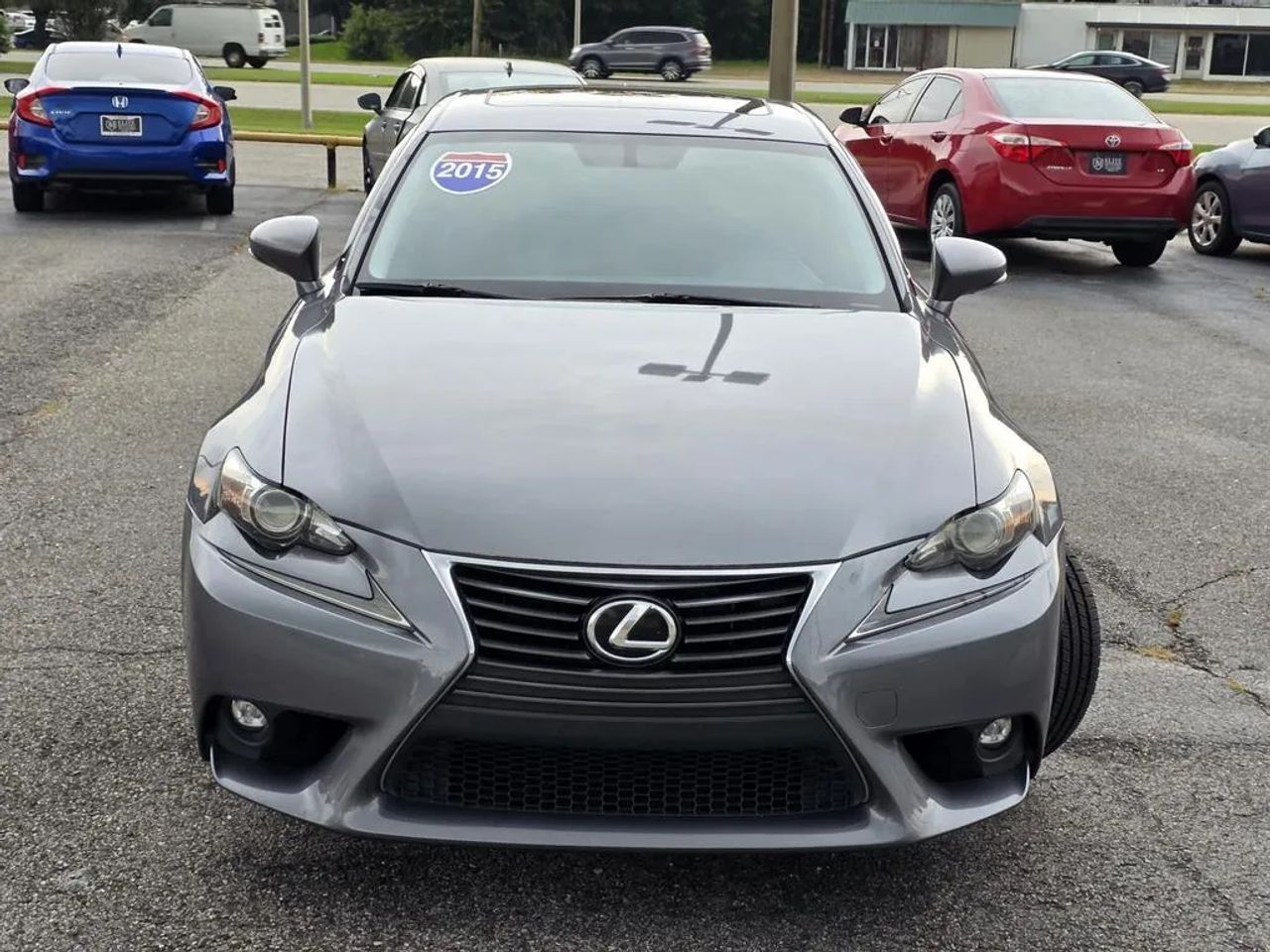 2015 Lexus IS 250 Sedan driving near Mobile Alabama showcasing luxury design